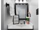 Bathroom vanity with framed mirror and humorous art piece on the counter at 1064 Brooks Rackley Rd, Dallas, GA 30157