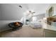 This carpeted bedroom has an accent chair, built in shelves and a ceiling fan at 1064 Brooks Rackley Rd, Dallas, GA 30157
