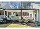 Relaxing covered patio area perfect for outdoor seating and enjoying the garden views at 1064 Brooks Rackley Rd, Dallas, GA 30157