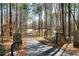 Gated driveway lined with mature trees leads to this secluded home at 1064 Brooks Rackley Rd, Dallas, GA 30157