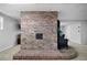 Basement brick fireplace with wood burning stove at 1064 Brooks Rackley Rd, Dallas, GA 30157
