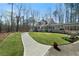 Well-maintained home with a lovely walkway, lush lawn, and inviting covered porch at 1064 Brooks Rackley Rd, Dallas, GA 30157
