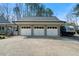 Detached three-car garage featuring carriage doors and a paved driveway; RV parking to the right at 1064 Brooks Rackley Rd, Dallas, GA 30157