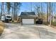 Detached garage with a large parking area, carport, and RV parking at 1064 Brooks Rackley Rd, Dallas, GA 30157