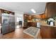 Kitchen with stainless steel appliances, wooden cabinets, and brick flooring at 1064 Brooks Rackley Rd, Dallas, GA 30157