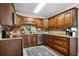 Kitchen with stainless steel appliances, granite countertops, and wood cabinetry at 1064 Brooks Rackley Rd, Dallas, GA 30157