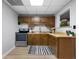 Basement kitchenette with stainless steel appliances and oak cabinets at 1064 Brooks Rackley Rd, Dallas, GA 30157