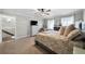 This large main bedroom has a fireplace, carpeted floors, and view to the entry at 1064 Brooks Rackley Rd, Dallas, GA 30157