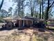 Charming brick home featuring a brick patio, carport, and fenced yard, great for outdoor living at 2567 Connally Dr, East Point, GA 30344