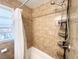 Bathroom featuring tiled walls, a shower with shower curtain, and extra shelving at 2567 Connally Dr, East Point, GA 30344