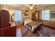 Bedroom featuring hardwood floors, natural light, and vintage furnishings at 2567 Connally Dr, East Point, GA 30344