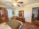Bedroom featuring hardwood floors, a large window, and lots of furniture at 2567 Connally Dr, East Point, GA 30344