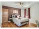 Cozy bedroom with hardwood floors, neutral paint, and plush bedding at 2567 Connally Dr, East Point, GA 30344
