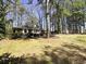 Well-maintained front yard and a charming brick house featuring white trim details at 2567 Connally Dr, East Point, GA 30344