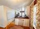 Eat-in kitchen with wooden table, island, and white cabinets, next to a whiteboard at 2567 Connally Dr, East Point, GA 30344