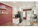 Bright kitchen featuring tile floor, stainless appliances, and painted accent wall at 2567 Connally Dr, East Point, GA 30344