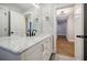 Bathroom with tile floor, single vanity with marble countertop and a large mirror at 5328 Monticello Dr, Villa Rica, GA 30180