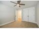Neutral bedroom featuring plush carpeting, ceiling fan, and closet at 5328 Monticello Dr, Villa Rica, GA 30180