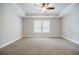Spacious bedroom featuring neutral carpeting, recessed lighting and tray ceiling with ceiling fan at 5328 Monticello Dr, Villa Rica, GA 30180