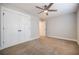 Bedroom featuring carpet, a ceiling fan, and closet space at 5328 Monticello Dr, Villa Rica, GA 30180