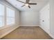 Bright bedroom featuring plush carpet, ceiling fan, and large window at 5328 Monticello Dr, Villa Rica, GA 30180