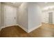 Inviting entryway features wood-look flooring, white trim and a white front door at 5328 Monticello Dr, Villa Rica, GA 30180