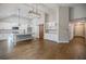 Open-concept kitchen featuring white cabinets, hardwood floors, and granite countertops at 5328 Monticello Dr, Villa Rica, GA 30180