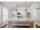 Kitchen features island, granite counters, stainless appliances, and pendant lighting at 5328 Monticello Dr, Villa Rica, GA 30180