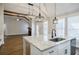 Spacious kitchen with granite island overlooking the living area at 5328 Monticello Dr, Villa Rica, GA 30180