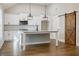 Island kitchen with white cabinets, stainless steel appliances, and granite countertops at 5328 Monticello Dr, Villa Rica, GA 30180