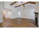 Open-concept living room boasts hardwood floors, vaulted ceilings, and stone fireplace at 5328 Monticello Dr, Villa Rica, GA 30180