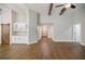 Bright, open-concept living room with hardwood floors, bar, and stylish barn door at 5328 Monticello Dr, Villa Rica, GA 30180