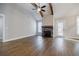 Living room offers stone fireplace, wood beams, wood flooring, and natural light at 5328 Monticello Dr, Villa Rica, GA 30180