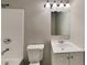 Bathroom features a tub, vanity, mirror and modern lighting at 908 Kennesaw Dr, Forest Park, GA 30297