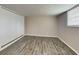 Bright bedroom features a large closet and wood-look flooring at 908 Kennesaw Dr, Forest Park, GA 30297