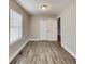 Bedroom includes a window for natural light and wood-look flooring at 908 Kennesaw Dr, Forest Park, GA 30297