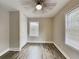 Bedroom with ceiling fan, built in closet and wood look floors at 908 Kennesaw Dr, Forest Park, GA 30297