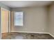 Bedroom with new flooring, window with blinds, and neutral colored walls at 908 Kennesaw Dr, Forest Park, GA 30297
