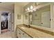 Bathroom features a granite vanity, large mirror, and walk-in closet at 3201 Lenox Rd Ne # 13, Atlanta, GA 30324