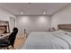Bedroom featuring a wooden bed frame, desk with shelves, a work chair, and neutral decor at 3201 Lenox Rd Ne # 13, Atlanta, GA 30324