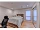 Bedroom with a queen bed, wood floors, natural light from a window, and mirrored closet doors at 3201 Lenox Rd Ne # 13, Atlanta, GA 30324