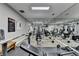 Mirrored home gym featuring various weight training machines and a weight training rules poster at 3201 Lenox Rd Ne # 13, Atlanta, GA 30324