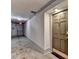 Hallway with carpet and neutral walls, doors, and lighting to adjacent rooms, exit door, and apartment entry at 3201 Lenox Rd Ne # 13, Atlanta, GA 30324