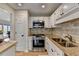 Gourmet kitchen featuring stainless steel appliances, granite countertops, and ample cabinet space at 3201 Lenox Rd Ne # 13, Atlanta, GA 30324