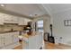 Bright kitchen with a functional island, stainless steel appliances, and wood floors at 3201 Lenox Rd Ne # 13, Atlanta, GA 30324