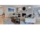 Open-concept living room boasts modern furnishings, a fireplace, and hardwood floors for a cozy and inviting atmosphere at 3201 Lenox Rd Ne # 13, Atlanta, GA 30324