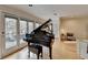 Sunlit living room featuring a grand piano, hardwood floors and a private balcony at 3201 Lenox Rd Ne # 13, Atlanta, GA 30324