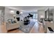 Spacious living room features a fireplace, piano, hardwood floors, and lots of natural light from the sliding glass doors at 3201 Lenox Rd Ne # 13, Atlanta, GA 30324