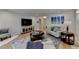 Bright living room features hardwood floors, modern decor and an open layout, creating a welcoming atmosphere at 3201 Lenox Rd Ne # 13, Atlanta, GA 30324