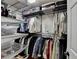 Organized walk-in closet with shelving, hanging rods, and ample storage space for clothes and accessories at 3201 Lenox Rd Ne # 13, Atlanta, GA 30324